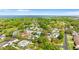 Community with mature trees near a body of water and a bridge in the distance at 2027 59Th N St, Clearwater, FL 33760
