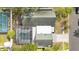 An overhead view showing the house with a screened-in pool and neighborhood streets at 2027 59Th N St, Clearwater, FL 33760