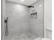 Modern bathroom shower featuring marble tiling, and mosaic floor at 2027 59Th N St, Clearwater, FL 33760