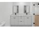 Modern bathroom featuring double sink vanity with white cabinets, marble countertop, and sleek black fixtures at 2027 59Th N St, Clearwater, FL 33760