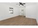 Bedroom showcasing wood-look flooring, white trim, and windows, offering a calming space at 2027 59Th N St, Clearwater, FL 33760