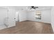 Large bedroom with wood floors, a ceiling fan, and a pool view at 2027 59Th N St, Clearwater, FL 33760