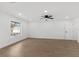Spacious bedroom with a ceiling fan, and a window with a view of the pool at 2027 59Th N St, Clearwater, FL 33760