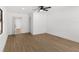 Bedroom showing wood-look flooring, ceiling fan and a closet that provides easy storage at 2027 59Th N St, Clearwater, FL 33760