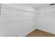 Walk-in closet with white walls, trim and wire shelving providing ample storage at 2027 59Th N St, Clearwater, FL 33760