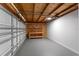Garage with gray floor, work bench and overhead lighting provides ample space for projects at 2027 59Th N St, Clearwater, FL 33760
