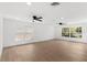 Spacious living room with hardwood floors, recessed lighting, and ample natural light at 2027 59Th N St, Clearwater, FL 33760