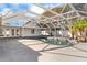 The screened pool, with a rock waterfall feature, is surrounded by a concrete pool deck and access to the home at 2027 59Th N St, Clearwater, FL 33760
