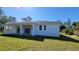 The backyard has sliding glass doors to get into the house with a covered porch at 23458 Macbeth Ct, Punta Gorda, FL 33980
