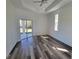 Bright and airy bedroom with sliding glass doors to the yard, vinyl plank flooring, and abundant natural light at 23458 Macbeth Ct, Punta Gorda, FL 33980