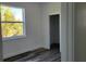 This bright bedroom is freshly painted with wood-look flooring, and features a window with scenic view at 23458 Macbeth Ct, Punta Gorda, FL 33980