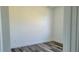 Cozy bedroom with wood-look floors and a neutral color palette, creating a relaxing atmosphere at 23458 Macbeth Ct, Punta Gorda, FL 33980