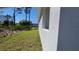Side view of house with window and landscaping at 23458 Macbeth Ct, Punta Gorda, FL 33980