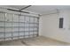 Spacious garage showing the garage door and room for parking and storage at 23458 Macbeth Ct, Punta Gorda, FL 33980