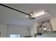 Well-lit garage with a modern garage door opener and HVAC system at 23458 Macbeth Ct, Punta Gorda, FL 33980