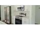Updated kitchen with stainless steel appliances, white cabinetry, and modern countertops offers a sleek and functional space at 23458 Macbeth Ct, Punta Gorda, FL 33980