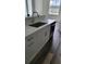 Stylish kitchen sink with stainless steel faucet and modern cabinetry, creating a functional and aesthetically pleasing space at 23458 Macbeth Ct, Punta Gorda, FL 33980