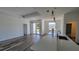 Open-concept living area with luxury vinyl plank flooring and ample natural light, ideal for modern living and entertaining at 23458 Macbeth Ct, Punta Gorda, FL 33980