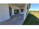 View of the patio on the back side of the house with ceiling fan at 23458 Macbeth Ct, Punta Gorda, FL 33980