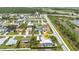 Areal shot of home featuring a screened-in pool, lush landscaping, and convenient RV parking at 23531 Dunstan Ave, Port Charlotte, FL 33954