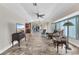 Open floor plan with tile flooring, connecting the living room to the kitchen and dining area at 23531 Dunstan Ave, Port Charlotte, FL 33954