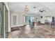 Spacious living room with tile flooring and large windows, perfect for relaxing at 23531 Dunstan Ave, Port Charlotte, FL 33954