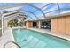 Relaxing screened-in pool area for outdoor entertaining, with lounge and dining space in the background at 23531 Dunstan Ave, Port Charlotte, FL 33954