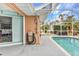 Large screened in pool with a clear blue water and outdoor shower at 23531 Dunstan Ave, Port Charlotte, FL 33954