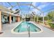Beautiful pool area with screened enclosure offering both sunny and shaded areas at 23531 Dunstan Ave, Port Charlotte, FL 33954