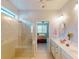 Bright bathroom with walk-in shower and dual vanity at 2436 Arugula Dr, North Port, FL 34289