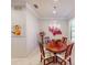 Elegant dining room features a chandelier and floral-patterned chairs at 2436 Arugula Dr, North Port, FL 34289