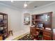 Home office with custom built-in desk and shelving unit at 2436 Arugula Dr, North Port, FL 34289