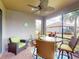 Screened lanai featuring a dining table, chairs, and comfortable seating area at 2436 Arugula Dr, North Port, FL 34289