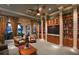 Cozy library space with comfortable seating, built-in bookshelves, and natural light at 2436 Arugula Dr, North Port, FL 34289