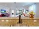 View of the home's living room showcasing an open floor plan, granite counters, and tile flooring at 2436 Arugula Dr, North Port, FL 34289