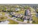 Aerial shot displaying the layout of homes, complemented by verdant landscaping and community pools at 26169 Explorer Rd # 7P, Punta Gorda, FL 33983