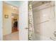 Bright bathroom with a tub featuring a colorful shower curtain and convenient grab bar at 26169 Explorer Rd # 7P, Punta Gorda, FL 33983