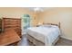 Inviting bedroom with a neutral color palette and a large window offering natural light at 26169 Explorer Rd # 7P, Punta Gorda, FL 33983