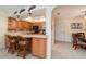 Well-equipped kitchen with stainless steel appliances, breakfast bar and adjacent dining area at 26169 Explorer Rd # 7P, Punta Gorda, FL 33983