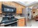 Updated kitchen with stainless steel appliances, granite counters, and ample cabinet storage at 26169 Explorer Rd # 7P, Punta Gorda, FL 33983