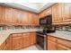 Modern kitchen featuring granite countertops, tile backsplash, and stainless steel appliances at 26169 Explorer Rd # 7P, Punta Gorda, FL 33983