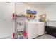 Well-equipped laundry room with a sink, shelving, and a modern washer and dryer at 26169 Explorer Rd # 7P, Punta Gorda, FL 33983