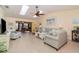 Bright and airy living room featuring skylights, tile flooring, and comfortable seating arrangements at 26169 Explorer Rd # 7P, Punta Gorda, FL 33983