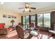 Inviting sunroom with tile floors and large windows, offering picturesque outdoor views at 26169 Explorer Rd # 7P, Punta Gorda, FL 33983
