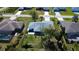 A charming single Gathering home sits on a well-maintained lot with a screened lanai and mature trees at 27250 Salta Dr, Punta Gorda, FL 33983