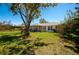 A lovely single Gathering home offers a screened lanai overlooking a spacious, well-maintained backyard with lush landscaping at 27250 Salta Dr, Punta Gorda, FL 33983