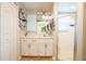 Bathroom featuring a modern vanity with white cabinets and a sliding glass shower door at 27250 Salta Dr, Punta Gorda, FL 33983