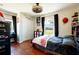 Bedroom boasting wood floors, double windows, closet, and modern decor at 27250 Salta Dr, Punta Gorda, FL 33983