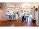 Bright kitchen and dining area with hardwood floors, stainless steel appliances and lots of natural light at 27250 Salta Dr, Punta Gorda, FL 33983