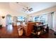 Cozy living room boasts hardwood floors, a leather sofa and a view of the well manicured front yard at 27250 Salta Dr, Punta Gorda, FL 33983